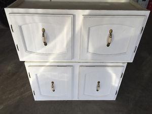 Two white upper cabinets