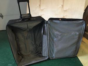 2 American Tourister softside suitcases.