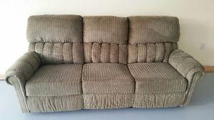 As new dual recliner couch and love seat