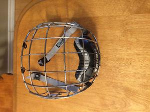 Brand new. Worn once Bauer Hockey Cage