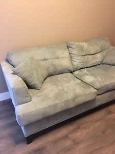 Light blue couch for a good home