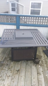 Propane fire pit and four chairs