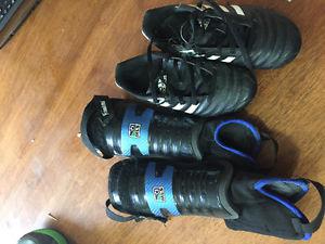 Size 13 soccer shoes and shin guards.