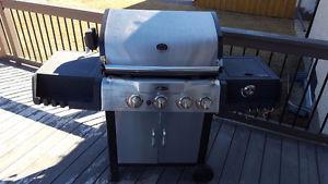 Stainless steel BBQ for sale. Propane tank not included.
