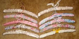 Ten wooden padded Hangers with ribbon detailing for $4
