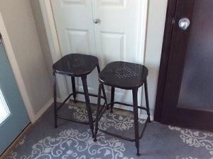 Two metal bar stools