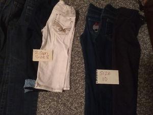 Various girls pants and shoes