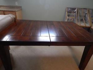 solid wood dining table and 8 chairs