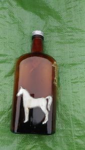 Antique White Horse Distilleries Ltd bottle with emblem and