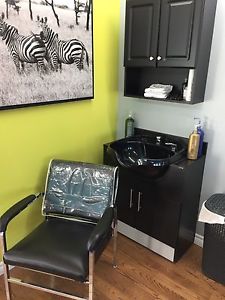 Shampoo chair, sink, and towel cupboard