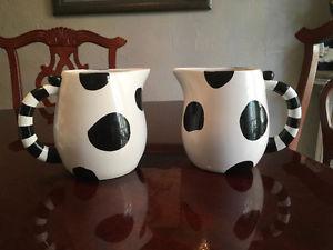 Two cow pitchers