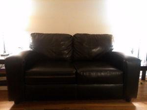 Two seater Black leather sofa, mint condition.