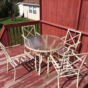 USED 4 CHAIRS & PATIO TABLE