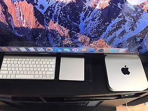 apple Mac Mini with Apple keyboard and trackpad