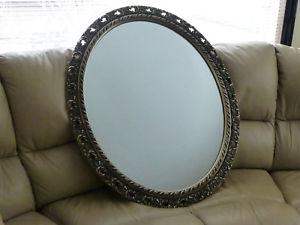 large oval carved mirror
