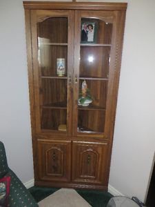 Corner cabinet for books tapes etc.