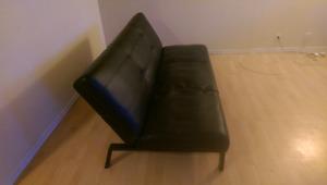 sofa bed leather futon 50 $ it has a little damage on