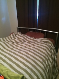 Double bed with metal frame and mattress