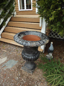 2 large cast iron planters for sale 60. for both