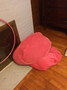 2 pink bean bag chairs