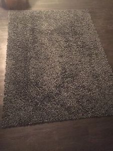 Dark grey living room rug