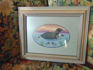 LOON PETIPOINT FRAMED IN A 8 BY 10 FRAME