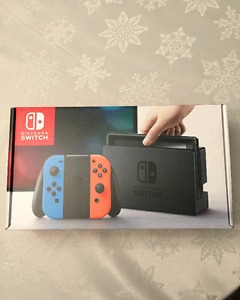 Nintedno switch with 2 games and joycon charging grip