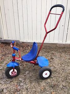 Radio flyer tricycle with trunk and canopy