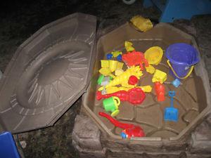 Sand box with toys