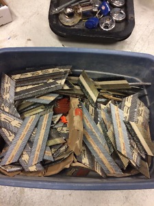 container of left over paslode nails