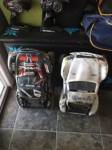2 traxxas slashes both vxl 4x4 lipos and charger $300 firm