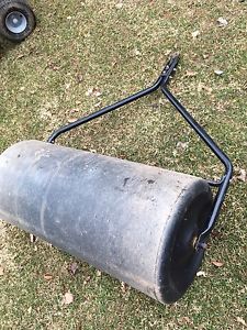 Lawn roller attachment for ride on lawn mover
