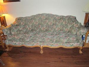 Victorian couch with claw legs.