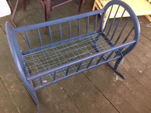 I AM SELLING A LARGE ANTIQUE BABY CRADLE