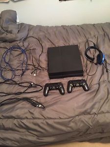 PlayStation 4 with 2 controllers and headset