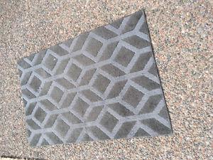 Grey rug with rubber backing