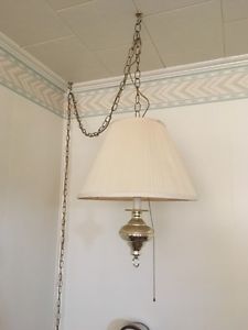 One hanging swag lamp and two table lamps