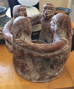 This is a vintage MAYAN/ AZTEC RED CLAY CIRCLE OF FRIENDS