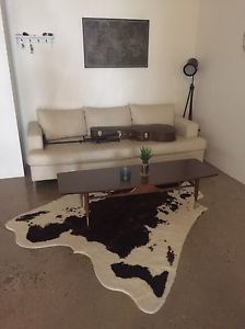 Brown and White cowhide rug