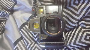 Canon qA camera with flash lens cap, strap, manual