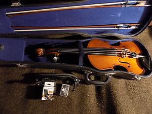 Full size fiddle, case, 2 bows,shoulder rest, tuner & rosin.