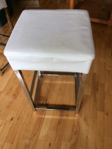 2 white leather stools