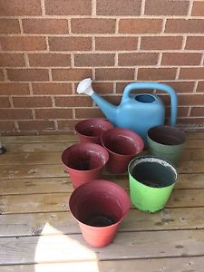 6 flower pots and water jug $10