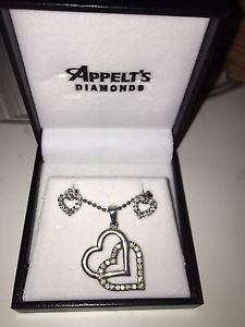 Appelt's silver heart necklace and earrings