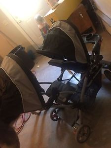 Double sit and stand stroller