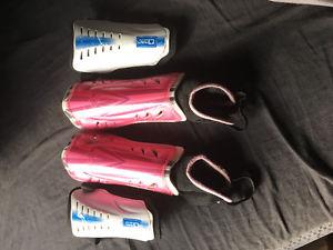 Two pairs of soccer shin pads