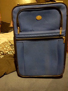 Blue carry on size suitcase