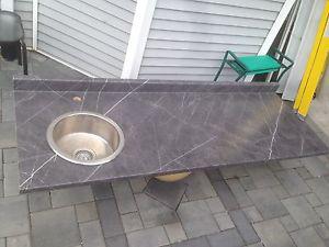 Countertop with stainless steel sink.