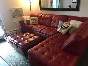Red sectional couch with matching ottoman