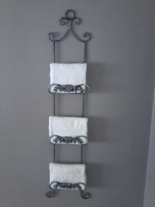 TWO WROUGHT IRON TOWEL,PLATE OR PICTURE HOLDERS